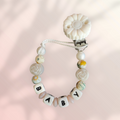 Attache tétine floral